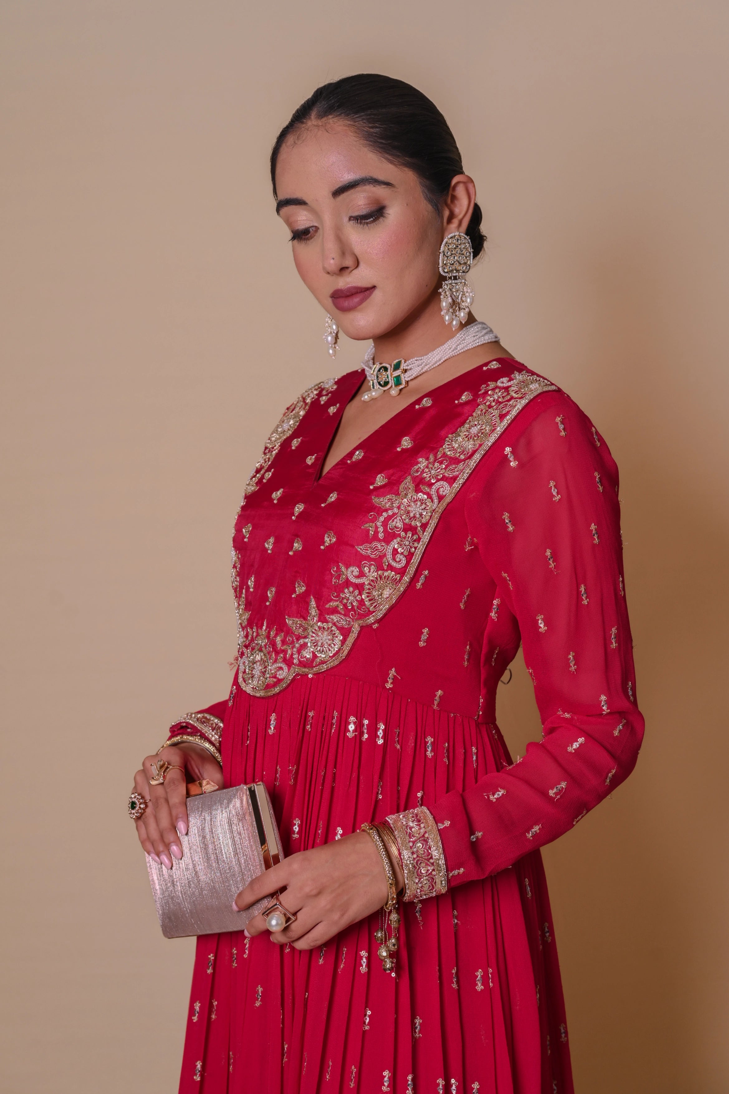 pleated anarkali dress Introducing our stunning pleated Anarkali gown, a beautiful fusion of tradition and modern elegance. Crafted from a luxurious saree provided by our client, this gown showcases intricate craftsmanship and attention to detail
